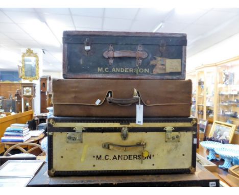 A vintage trunk together with two vintage suitcases all with initials and original travel labels (3)