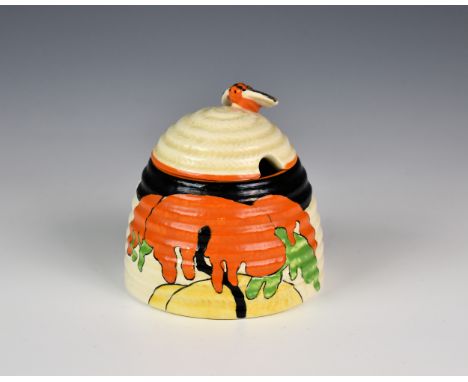 A Clarice Cliff Beehive honey pot & cover, the hand painted honeyglaze pot in the Woodland pattern, 1930s, stamped to base, '