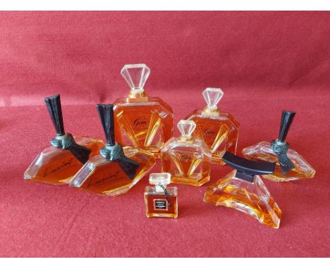 Collection of vintage glass perfume bottles with original contents.