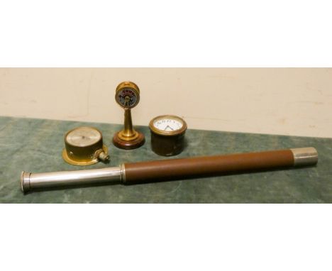 Old brass clock, thermometer, telescope and a model telegraph 