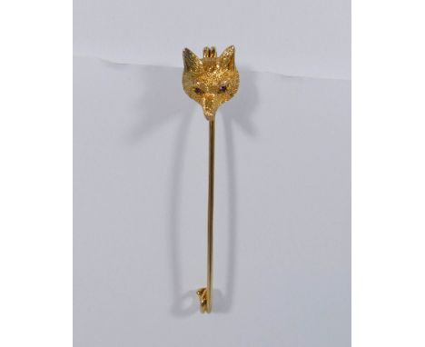 A late Victorian yellow gold fox mask stock pin, the well cast fox mask set with ruby eyes, stamped 9ct, gross weight 7gms