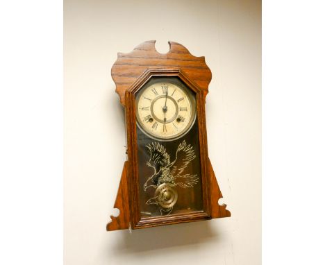 An American shelf clock in oak case with striking movement 