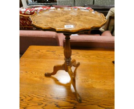 A reproduction walnut wine table on tripod base together with a similar mahogany table 