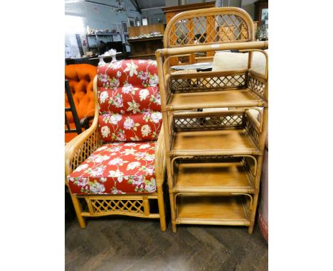 A bamboo conservatory armchair with red floral patterned cushions, together with a matching five tier shelf unit 