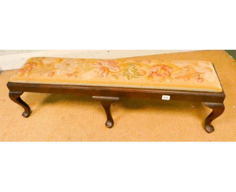 A long mahogany footstool on cabriole legs with bead work style tapestry top   Approx;40 inches in length.11.5 inches height.