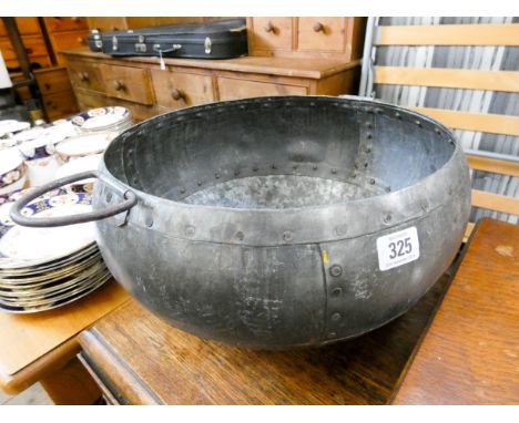 An Indian light metal bowl with two handles 