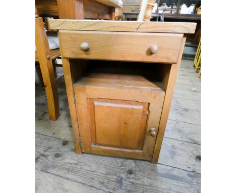 A well made light oak bedside cabinet fitted cupboard and drawer 