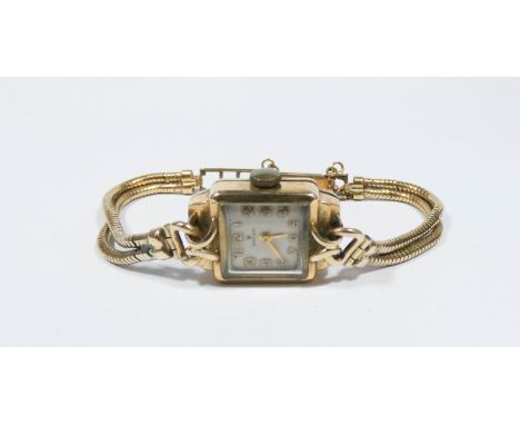 A ladies vintage Rolex 9ct gold square faced dress watch on flexible gold plated strap