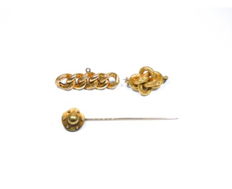 Three Victorian gold brooches, two of which are rope twists and a stick pin unmarked tests as gold 15.8gms 