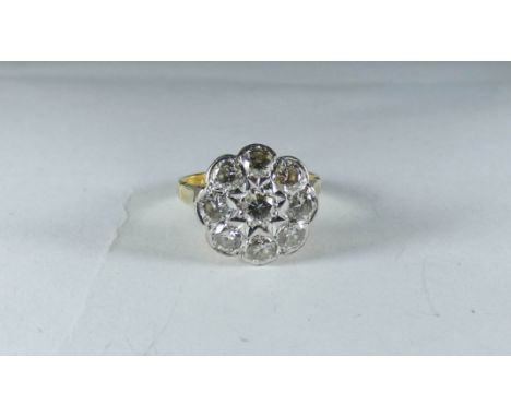 A diamond daisy flower head cluster ring on an 18ct gold shank ring size J 