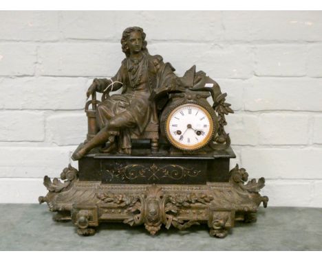 A French striking mantle clock with spelter poet figure mount on a marble and gilt metal decorative base 