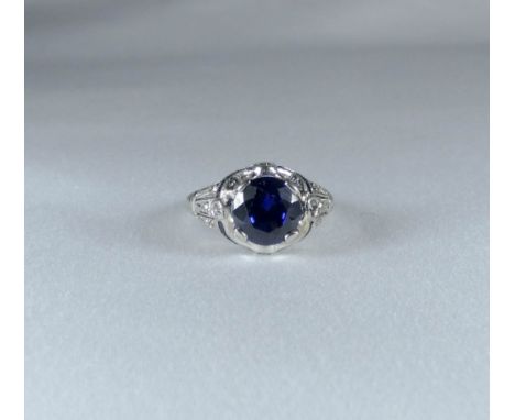 Platinum diamond and synthetic sapphire Art Deco ring, unmarked white metal mount, ring size J   one diamond missing from mou