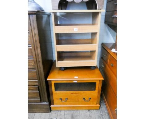 A small modern HiFi cabinet and a four tier light wood rack 