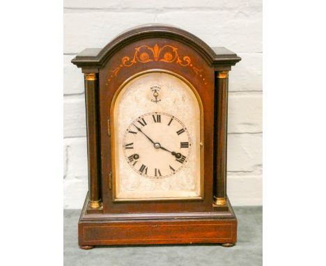 An Edwardian striking bracket clock in inlaid mahogany case with arched silver dial 