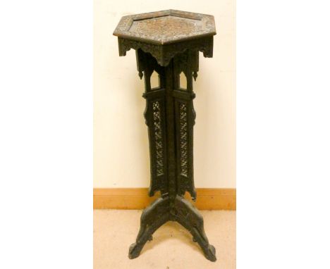 An hexagonal carved oak plant pedestal on a tripod base similar to previous lot 39 1/2" tall 