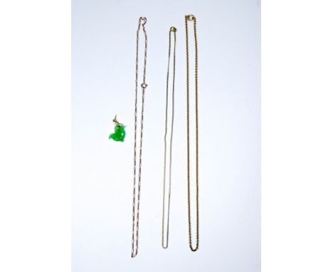 Carved jade pendant and a large Chinese jade brooch together with three chain necklaces 