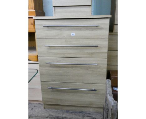 A modern light oak finished tallboy chest of four long drawers 2'6 wide matching the previous lot 