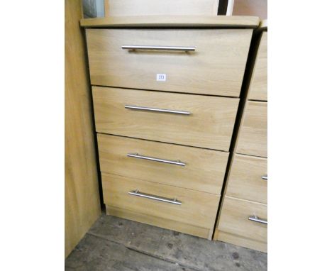 A modern light oak finished chest of four long drawers 2' wide matching the previous lots 