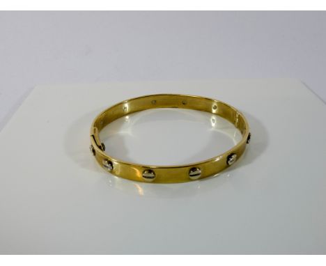 Cartier style love bangle in 9ct yellow gold, weight 20 grams