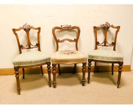 A pair of late Victorian walnut dining room chairs with upholstered seats and one odd Victorian mahogany chair with tapestry 