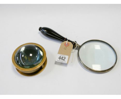 Heavy circular brass compass and a magnifying glass 