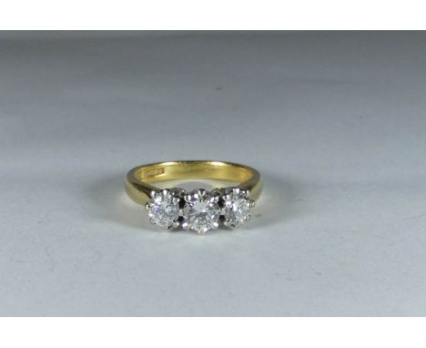 A three stone diamond ring on 18ct yellow gold shank, ring size K   Weight approx. - 4gMiddle stone length approx. - 4.5mmMid