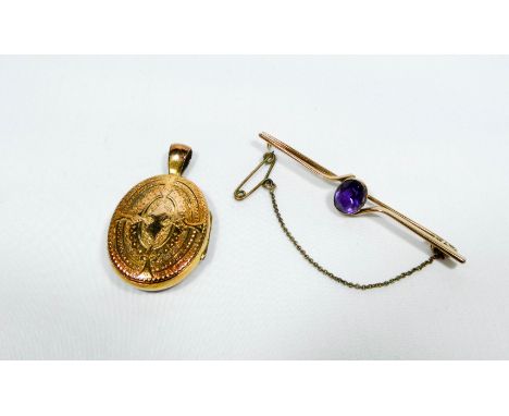 Edwardian amethyst set bar brooch together with an oval locket with enamel decoration.  Neither piece hallmarked