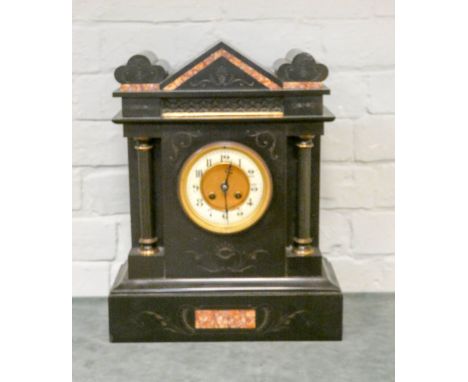 A large Victorian striking mantle clock in b lack marble case 