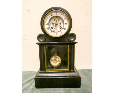 A French striking mantle clock with regulator style pendulum in black marble and glazed case, signed Brest Aine Paris 