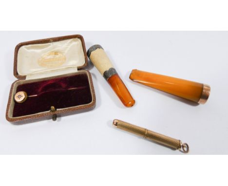 9ct rose gold amber cheroot holder, another cheroot holder with silver mounts, 9ct gold propelling toothpick and a 9ct gold s