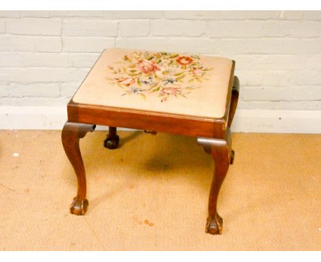 A Chippendale style mahogany dressing stool with tapestry top standing on cabriole legs with claw and ball feet 
