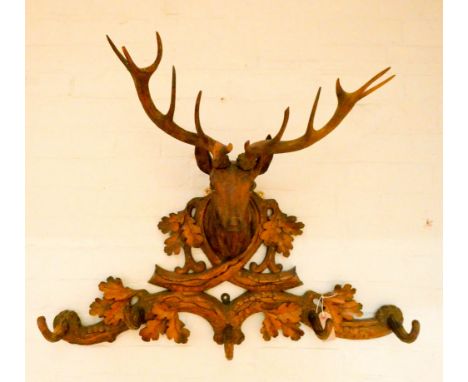 A Black Forrest style carved stags head hall coat hook  Condition Report;It has previously been broken off and repaired the w