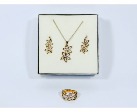 Pretty modern suite of gold and diamond jewellery, consisting of diamond set flowers in 9ct yellow gold a pair of pierced dro