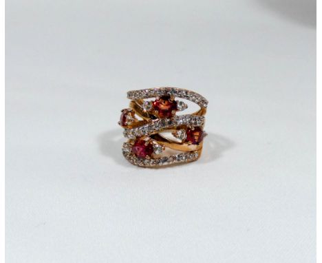 A 9ct rose gold diamond and orange sapphire contemporary dress ring size I together with retail replacement valuation for £95