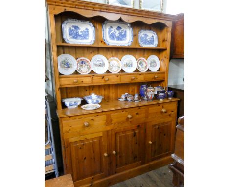 A modern pine kitchen dresser with shelf back and spice drawers on a drawer and cupboard base 5' wide 