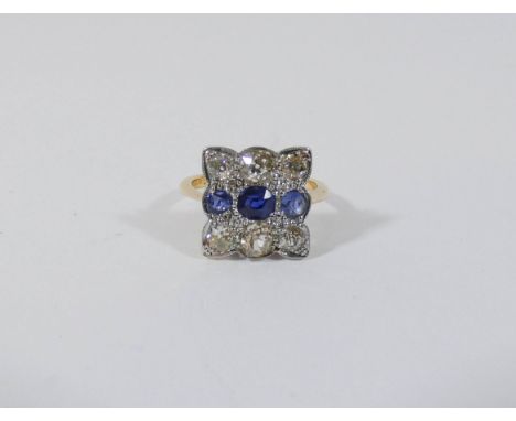 An Art Deco sapphire and diamond cluster ring, the square shaped panel set with three sapphires and six diamonds in 18ct yell