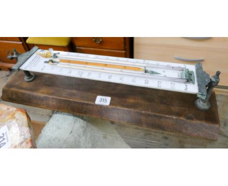 A Callaghan &amp; Co Centigrade and Fahrenheit outdoor thermometer on a wooden plinth 