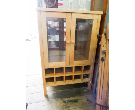 A light beech two door glazed display cabinet with wine racks under and inset marble top 27 1/2" wide 