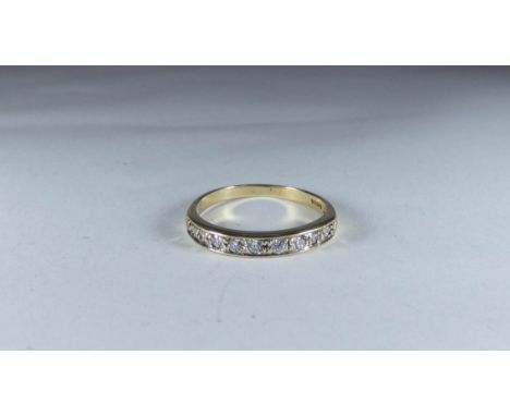 A 9ct yellow gold diamond set half eternity ring, ring size P 