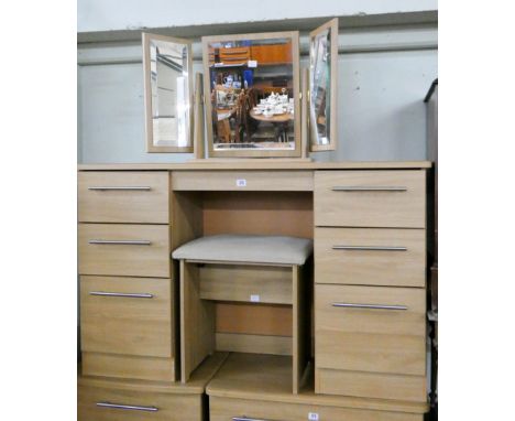 A modern light oak finish kneehole pedestal dressing table fitted six drawers with freestanding triple mirror and stool 