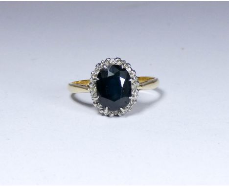 18ct gold sapphire and diamond oval cluster ring, ring size P  