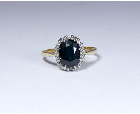 18ct gold sapphire and diamond oval cluster ring, ring size P  