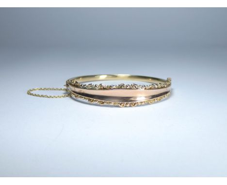 Victorian 9ct rose gold ladies hinged bangle with a safety chain fitting, 8.7gms 