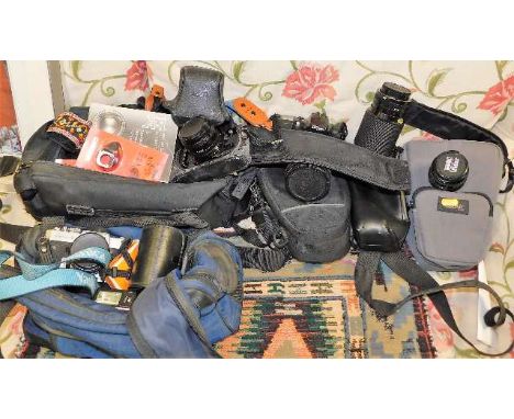 A quantity of 35mm camera equipment including a Canon A1, Minolta, Yashica, a Canon lens &amp; other various accessories 