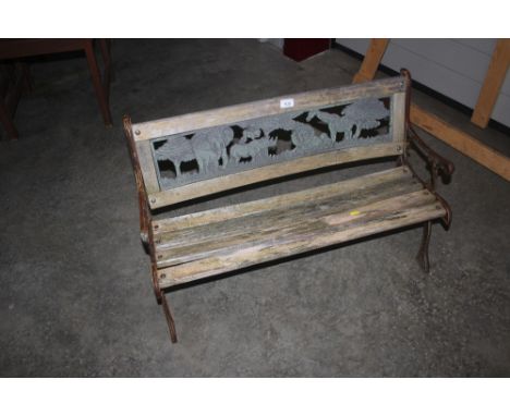 A wood and metal garden bench decorated with African animals