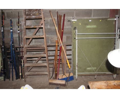 A bundle of long handled gardening tools etc