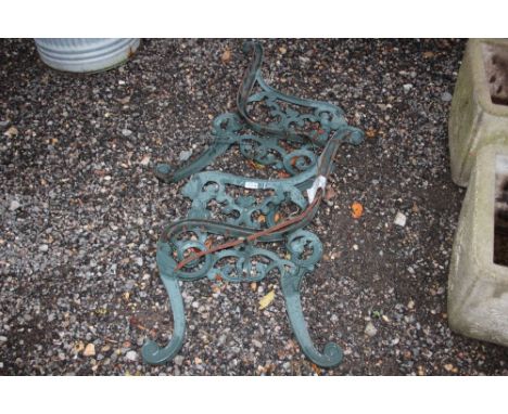 A pair of metal bench ends