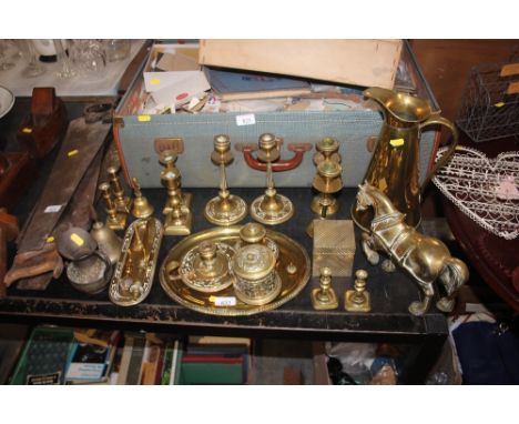 A quantity of brassware to include candlesticks, jug, horse ornament, chamber stick etc.