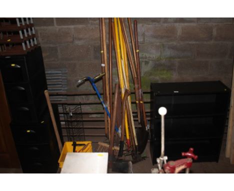 A quantity of long handled gardening tools