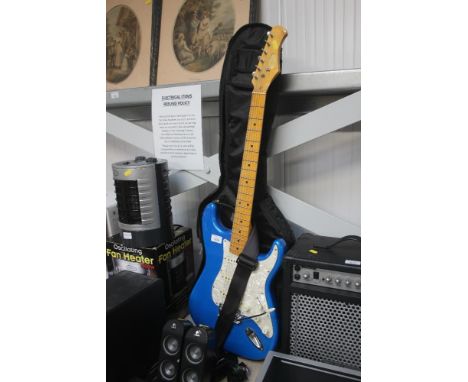 A blue Stagg Stratocaster electric guitar with strap and soft case